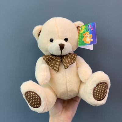 Игрушка Мишка плюшевый с бантом 18 см. средний N 84077